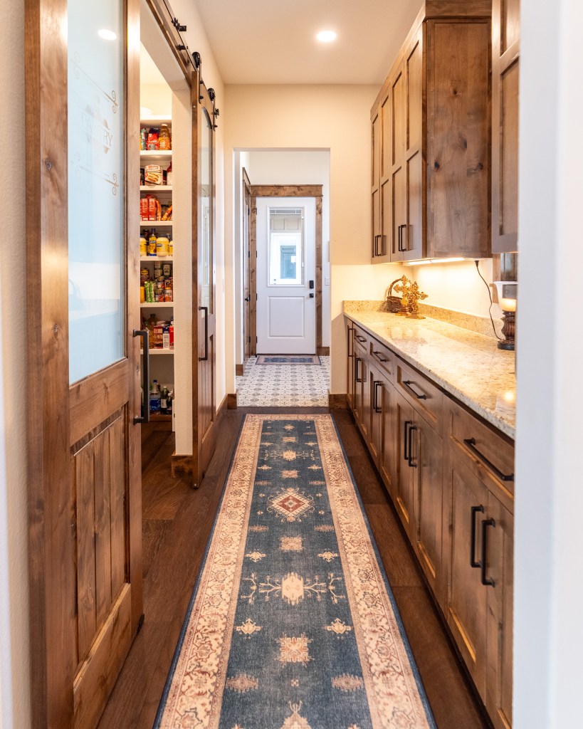 Custom cabinets and stone countertops in a Butcher Behrens kitchen